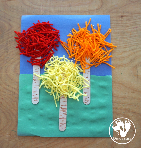 Yarn Truffula Trees - a fun and easy craft for the book The Lorax and Earth Day. You use paper, craft sticks and yarn to make the truffula trees. 3Dinosaurs.com