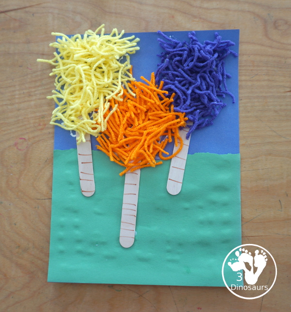 Yarn Truffula Trees - a fun and easy craft for the book The Lorax and Earth Day. You use paper, craft sticks and yarn to make the truffula trees. 3Dinosaurs.com