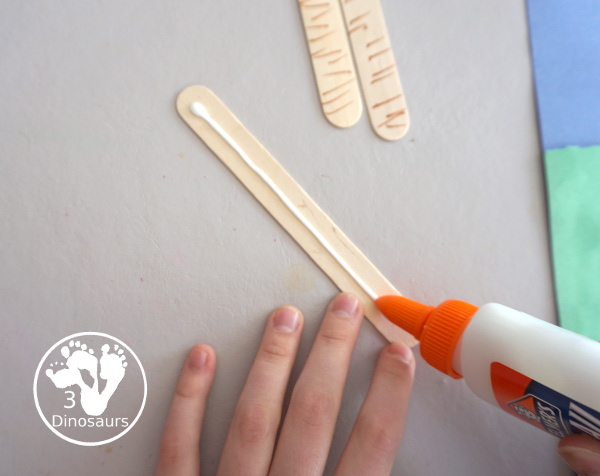 Yarn Truffula Trees - a fun and easy craft for the book The Lorax and Earth Day. You use paper, craft sticks and yarn to make the truffula trees. 3Dinosaurs.com