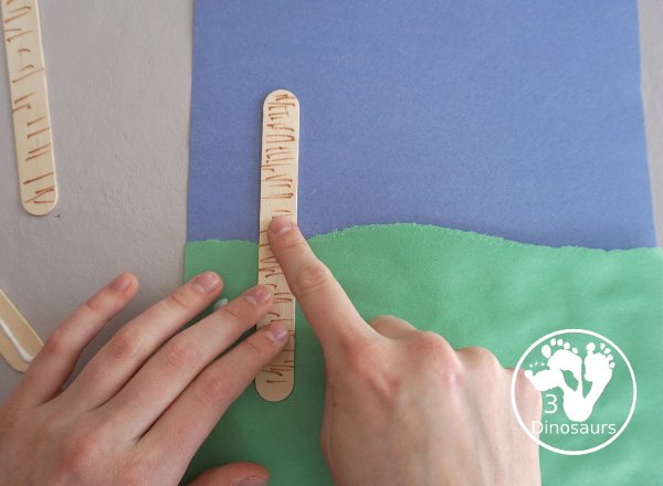 Yarn Truffula Trees - a fun and easy craft for the book The Lorax and Earth Day. You use paper, craft sticks and yarn to make the truffula trees. 3Dinosaurs.com