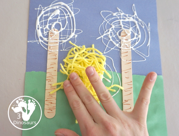 Yarn Truffula Trees - a fun and easy craft for the book The Lorax and Earth Day. You use paper, craft sticks and yarn to make the truffula trees. 3Dinosaurs.com