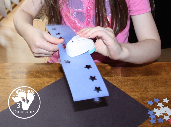 Red, White & Blue Star Craft - a fun star punch craft that is easy to do for kids of various ages. Kids will punch out the star and blue them on the black paper. A great Fourth of July Craft. 3Dinosaurs.com