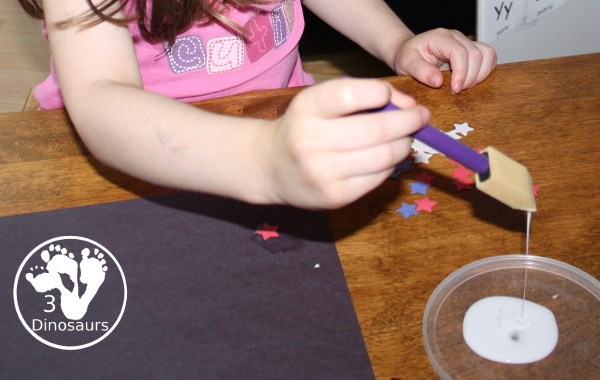 Red, White & Blue Star Craft - a fun star punch craft that is easy to do for kids of various ages. Kids will punch out the star and blue them on the black paper. A great Fourth of July Craft. 3Dinosaurs.com