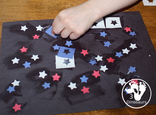 Red, White & Blue Star Craft - a fun star punch craft that is easy to do for kids of various ages. Kids will punch out the star and blue them on the black paper. A great Fourth of July Craft. 3Dinosaurs.com