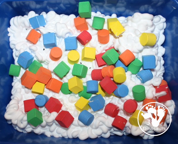 Shaving Cream and Foam Blocks Sensory Play - an easy to set up sensory play that can be done inside or outside with kids. It takes just a minute to set up with the shaving cream being the longest part. This is great for kids in preschool, prek, and kindergarten. 3Dinosaurs.com