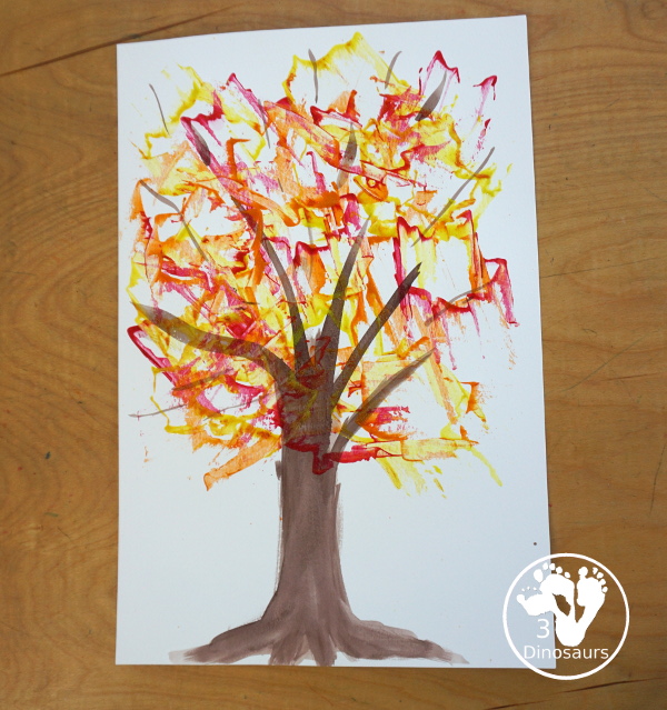 Fall Tree Scrape Painting with Leaf Cookie Cutters - a simple watercolor trunk and branches with leaf cookie cutter scrape painting. A great fall tree craft for kids. 3Dinosaurs.com