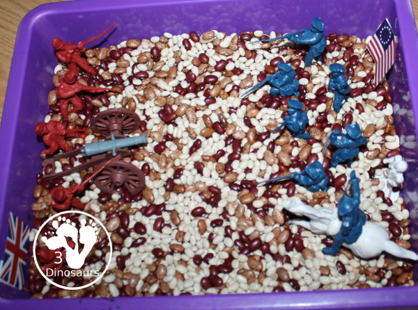 American Revolution Sensory Bin - a simple sensory bin made with beans and plastic figures for the American and British size of the war. 3Dinosaurs.com